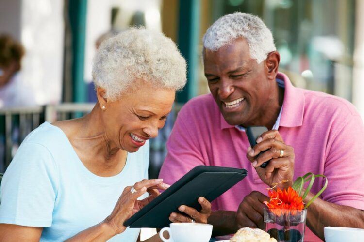 Older couple outside smiling