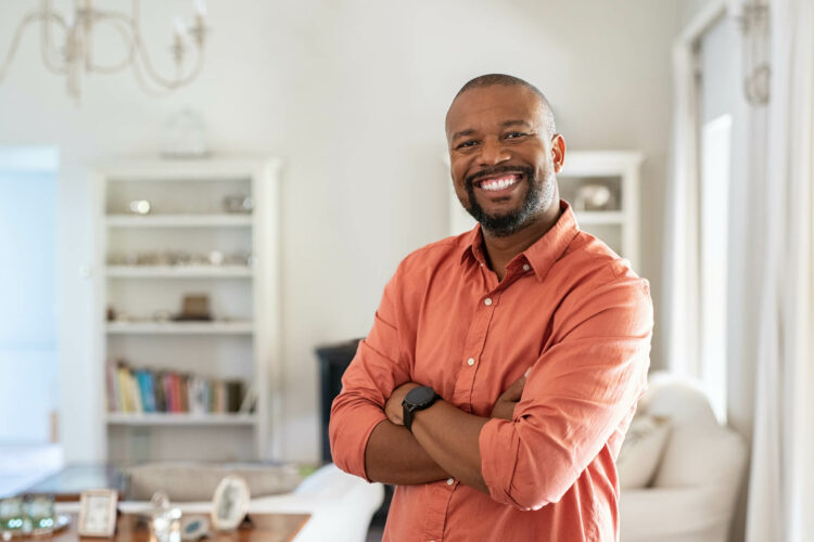 Smiling man inside home